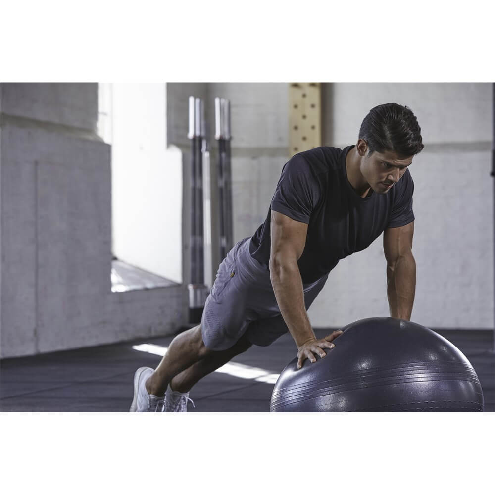 Man  exercising  using an Adidas 55cm Gym Ball