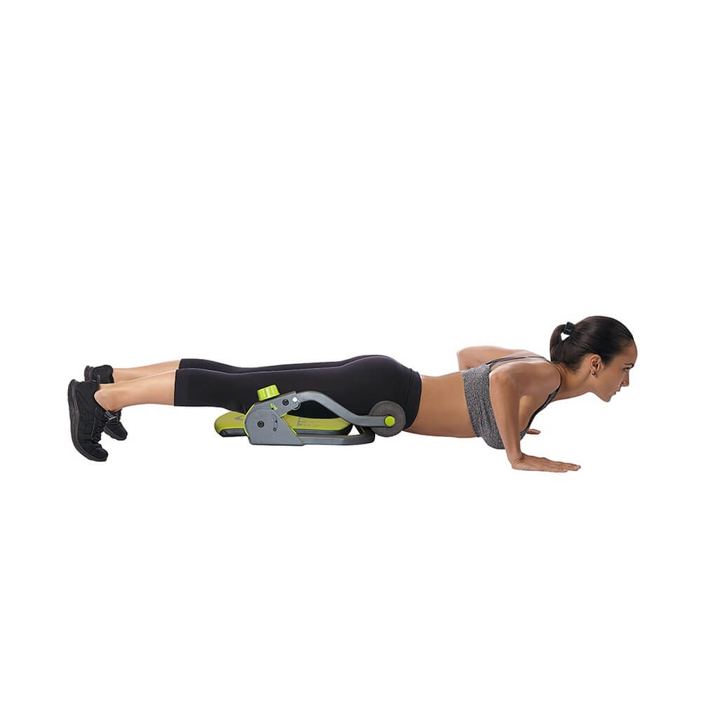 Woman performing press ups using a body-sculpture-core-trimmer