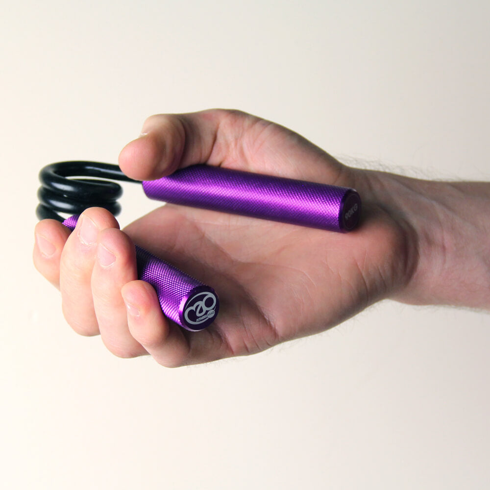 Man gripping a purple Fitness Mad Pro Power Hand Grip - 90kg Resistance