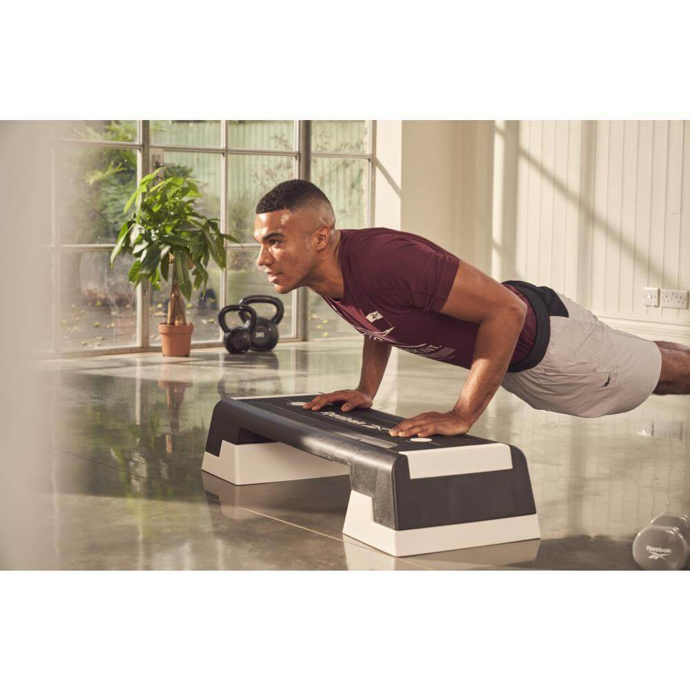 Man working out on a Reebok Cardio Step - White