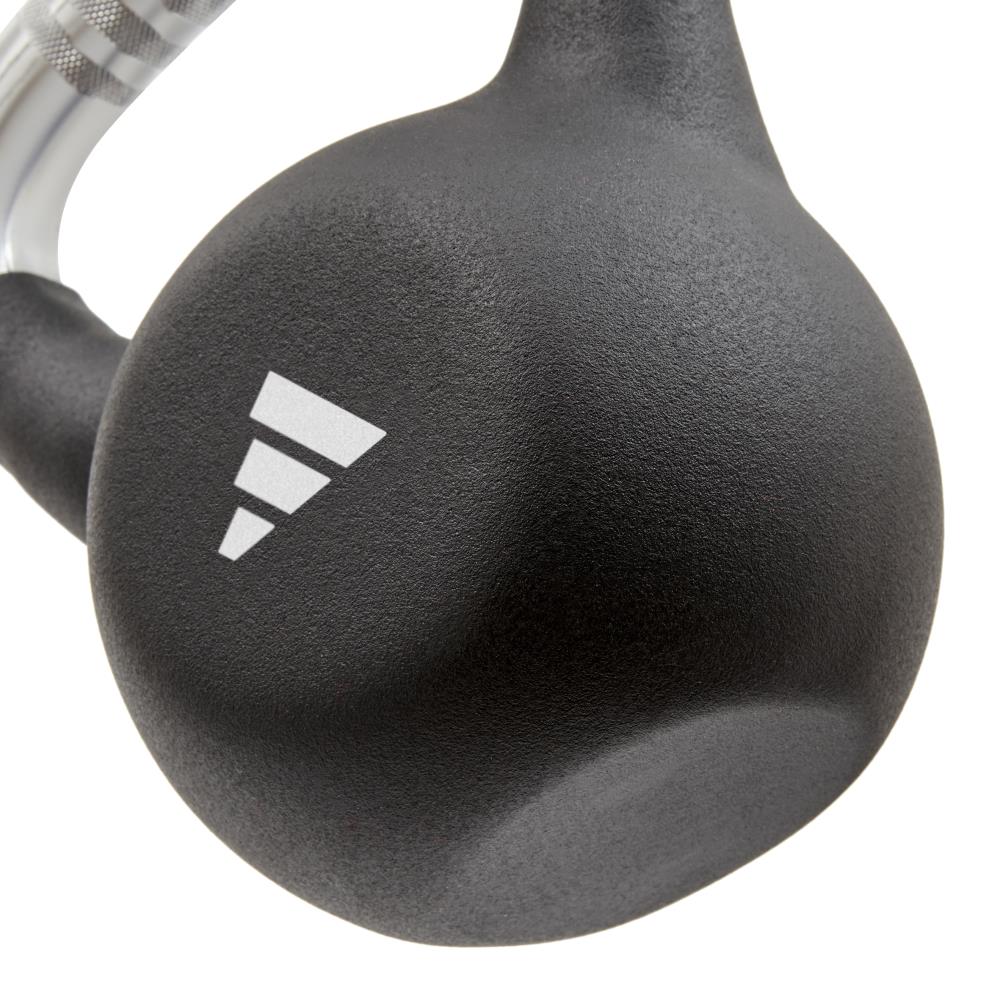 Black 12kg kettlebell with a adidas brand logo on a white background