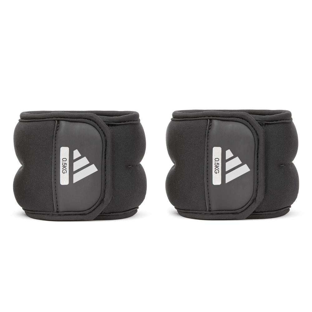 Pair of black 0.5kg ankle weights with Adidas logo on a white background