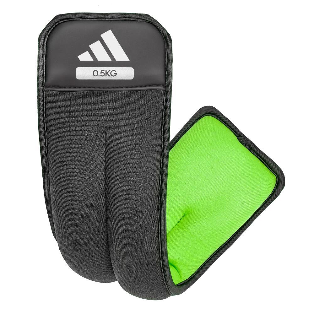 Black ankle/wrist weights with green interior and Adidas logo on a white background