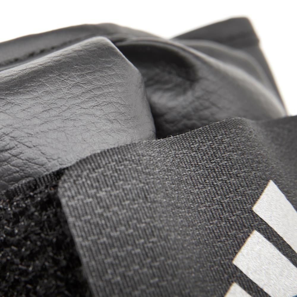 Close-up of gray textured fabric with Adidas logo
