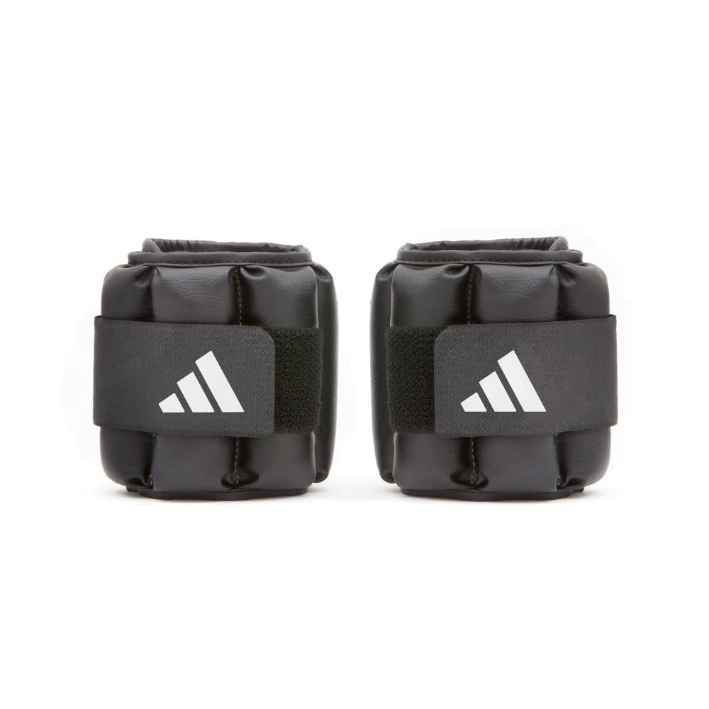 Pair of black Pair of black adidas Performance ankle/wrist weights 1.5kg with adidas logo on a white background