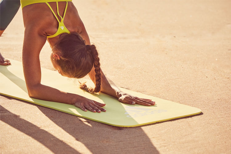 Yoga Pose on a Yellow Yoga Mat
