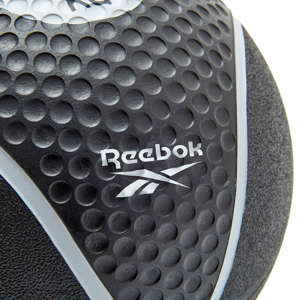 Close-up of a Reebok branded black and grey medicine ball