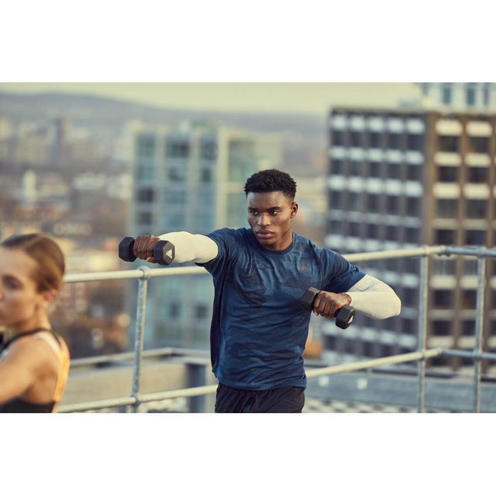 Man  holding adidas 3kg Dumbbells -performing a gym workout