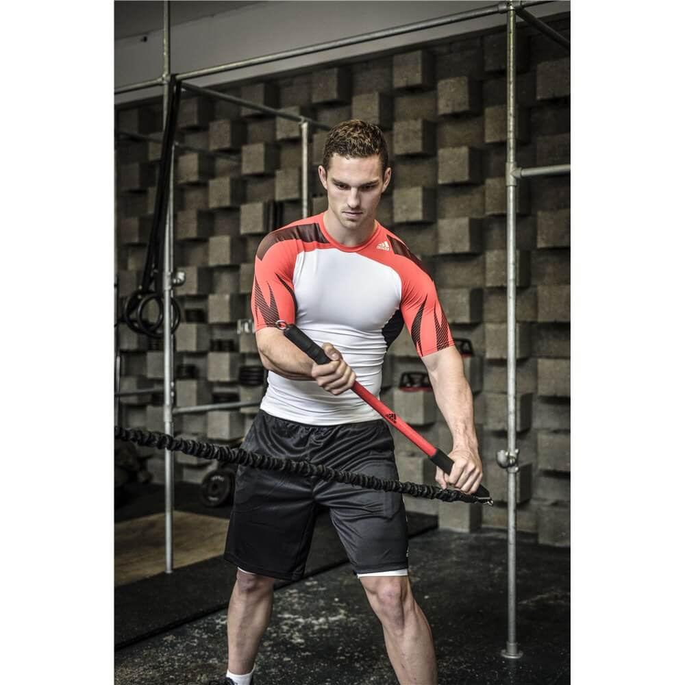 Man doing strength training using an adidas trainbar 