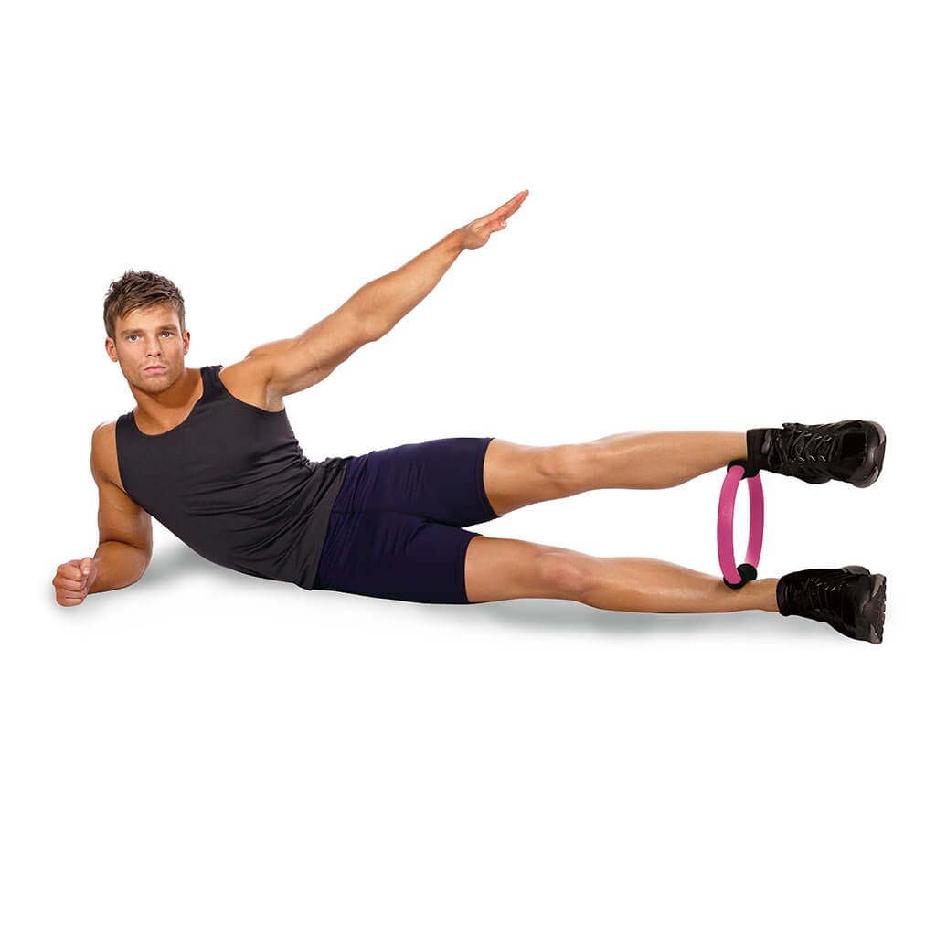 man exercising holding Body Sculpture Pilates ring between legs