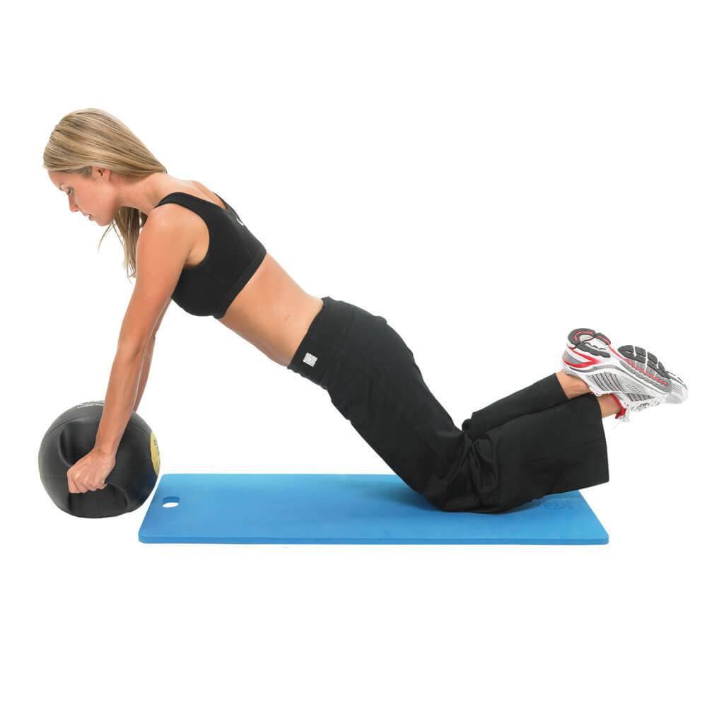 Woman exercising on a Fitness Mad 10mm Studio Aerobic Mat