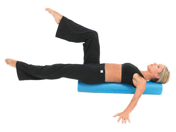 Woman using a Fitness Mad Foam Roller 90cm