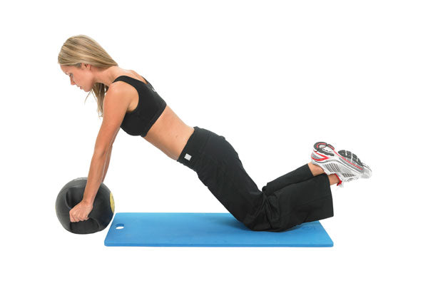 Woman performing press ups whilst kneeling on a Fitness Mad Studio Pro Aerobic Mat 15mm