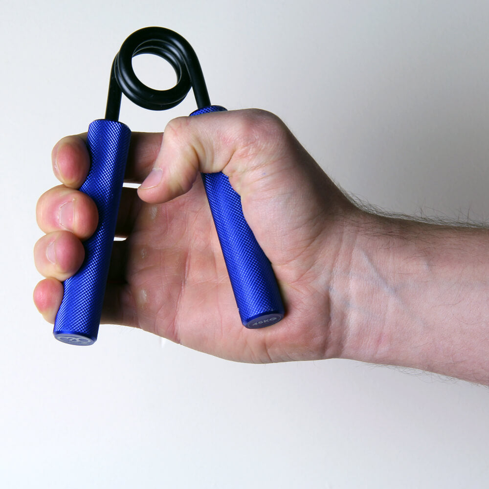 Man gripping a blue Fitness Mad  Pro Power Hand Grip - 45kg Resistance