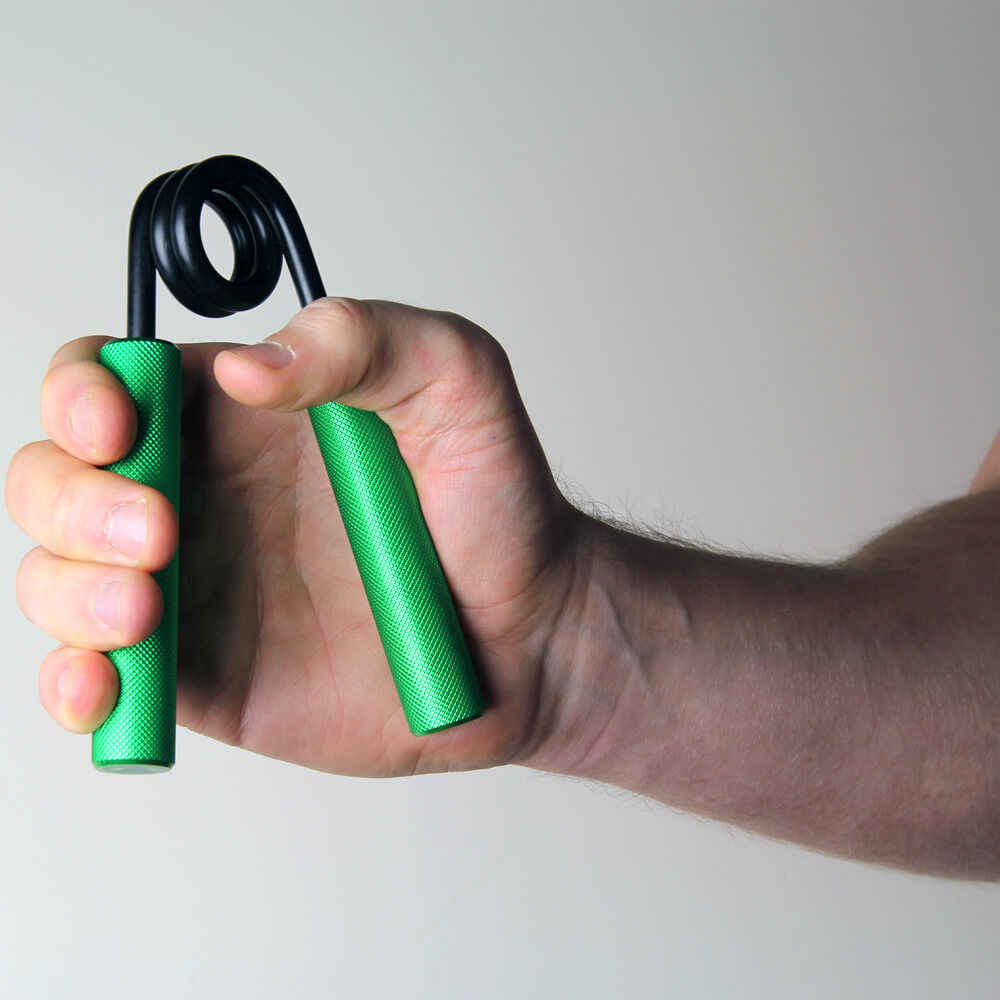 Man gripping a green Fitness Mad  Pro Power Hand Grip - 60kg Resistance