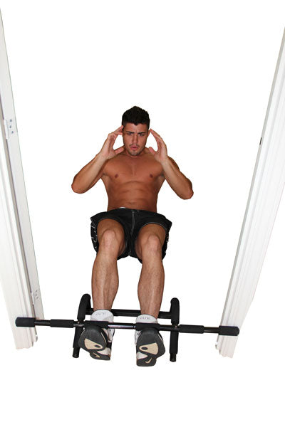 Man performing sit ups in a doorway using a Fitness Mad Universal Training Pull Up Bar