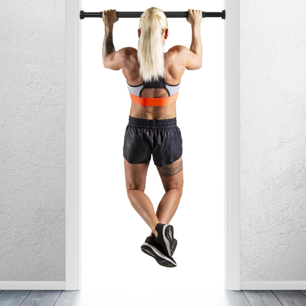 Woman performing chin ups using a HXGN Doorway Chin Up Bar - Pull Ups