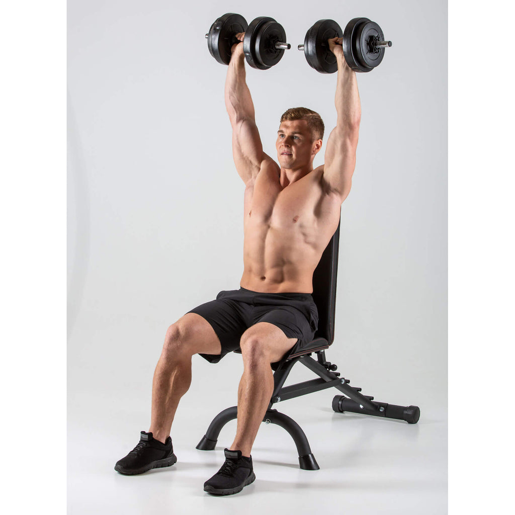 Man performing Shoulder Press on a HXGN Ultimate Dumbbell Weight Bench 