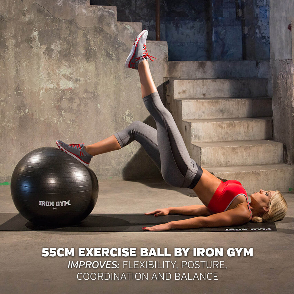 Woman exercising using an Iron Gym Essential Exercise Ball - 55cm