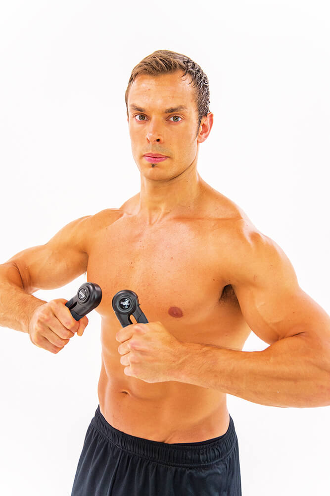 Man gripping Iron Gym Hand Grips Pair