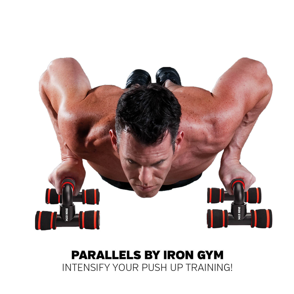Man performing push ups using Iron Gym Parallel Bars