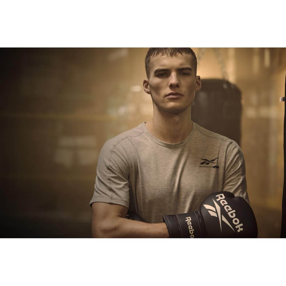 Man wearing Reebok Boxing Gloves - Black