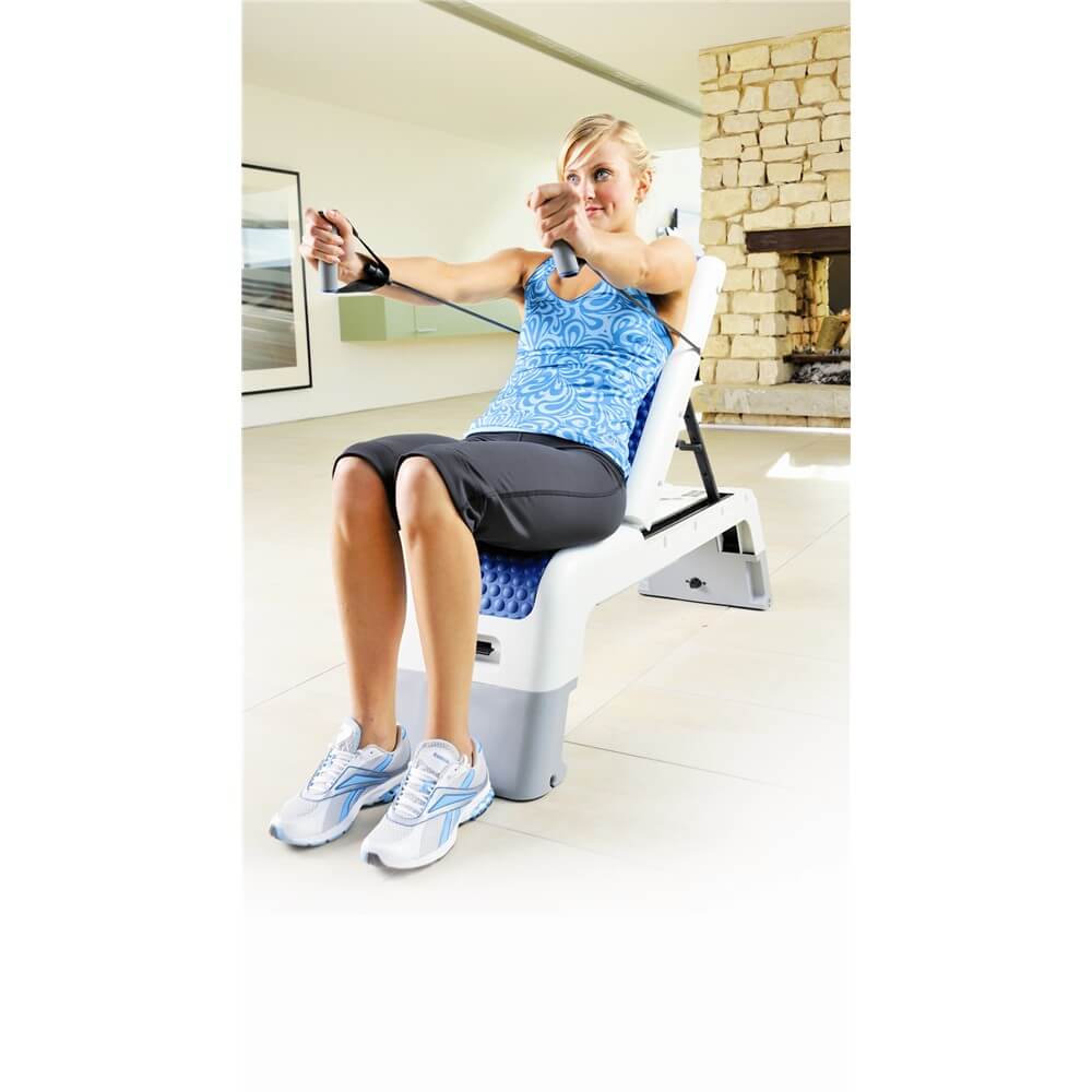 Woman sitting on a Reebok Deck doing a Resistance Tube Workout