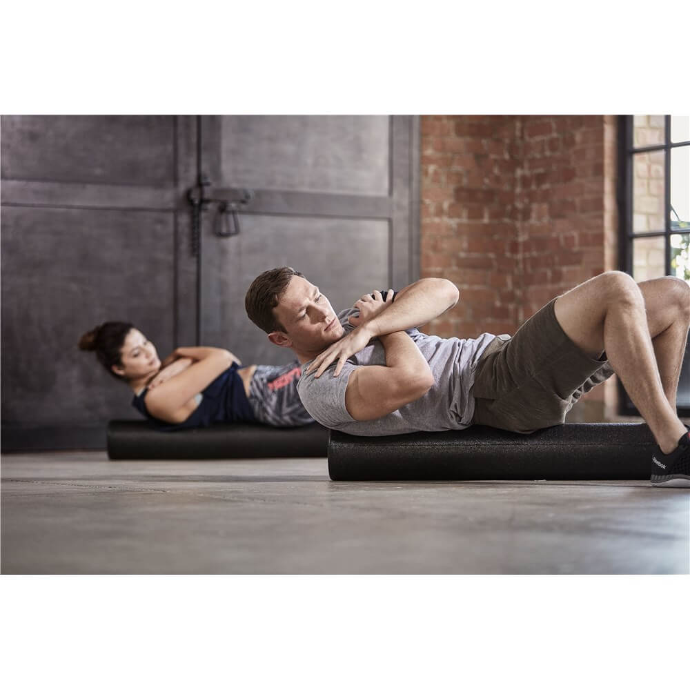 Exercise class using Reebok Long Foam Rollers
