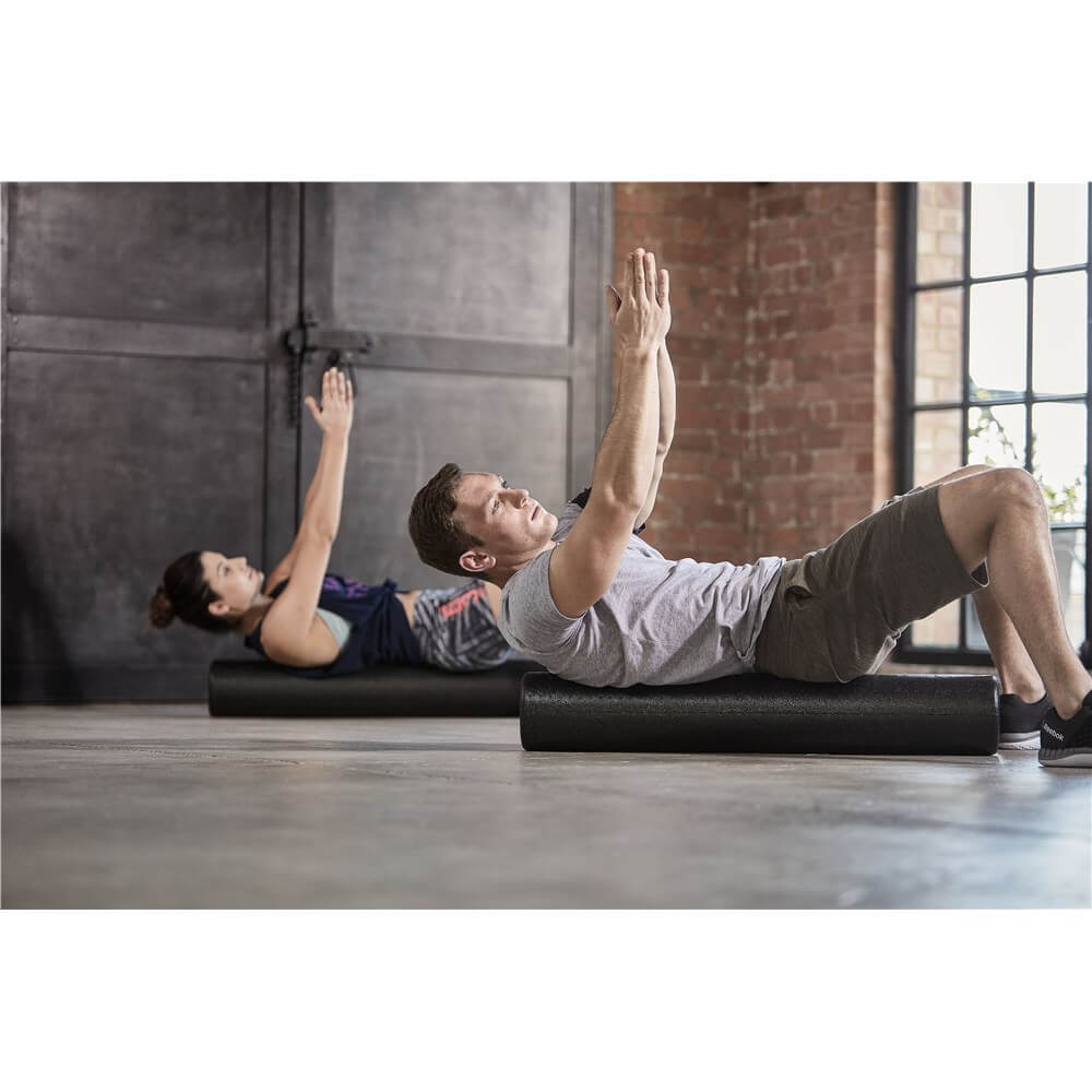 Exercise class foam rolling using Reebok Long Foam Rollers
