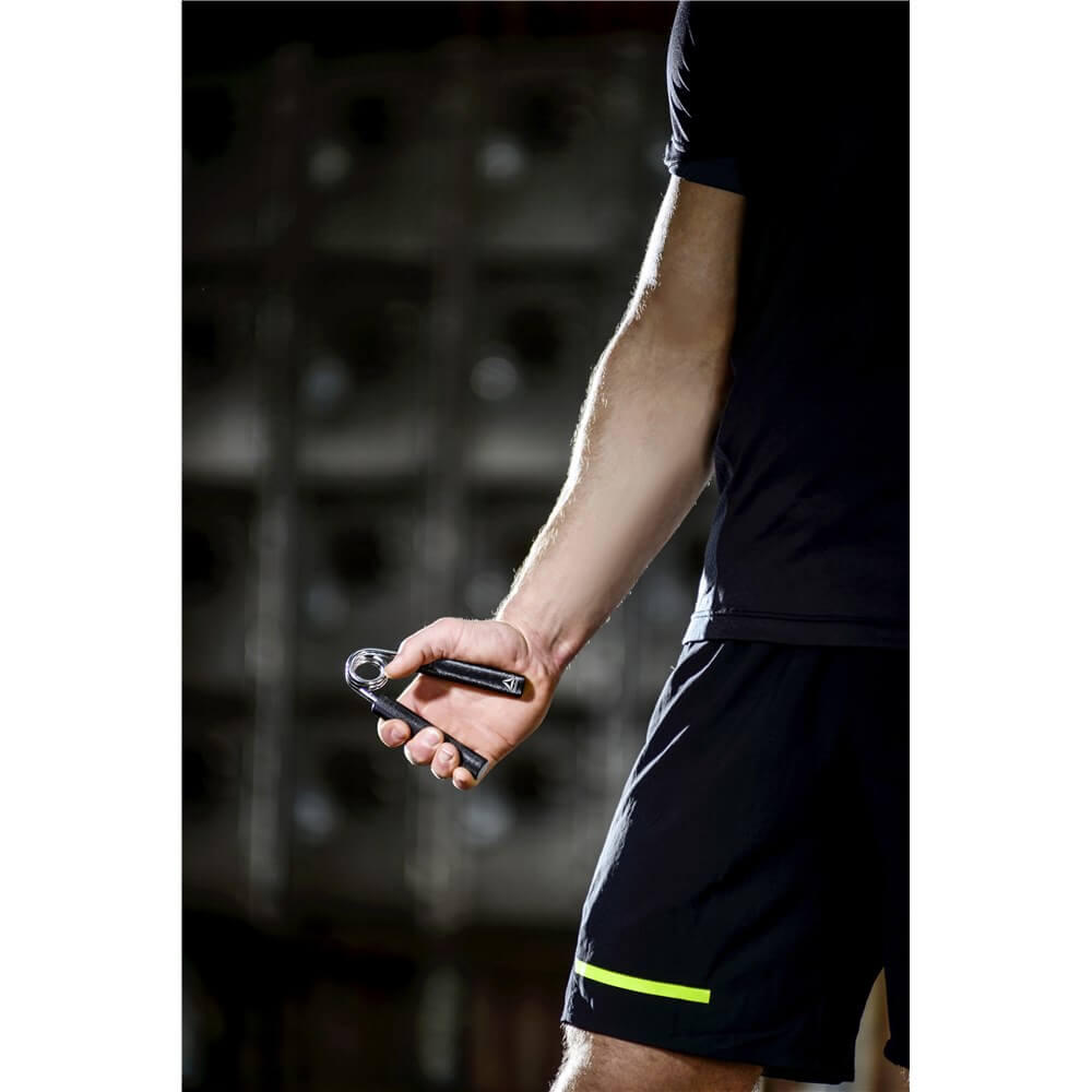 Man gripping a Reebok Mens Grip Trainer - Forearm Exerciser 