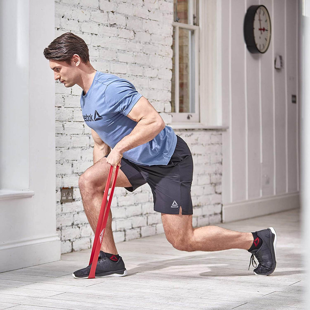 Man working out using Reebok Glute Bands