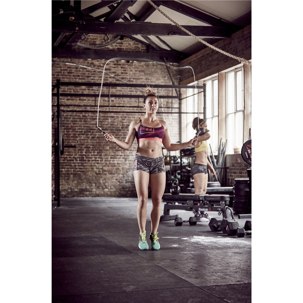 Woman skipping in the gym with a Reebok Premium Speed Rope - Skipping