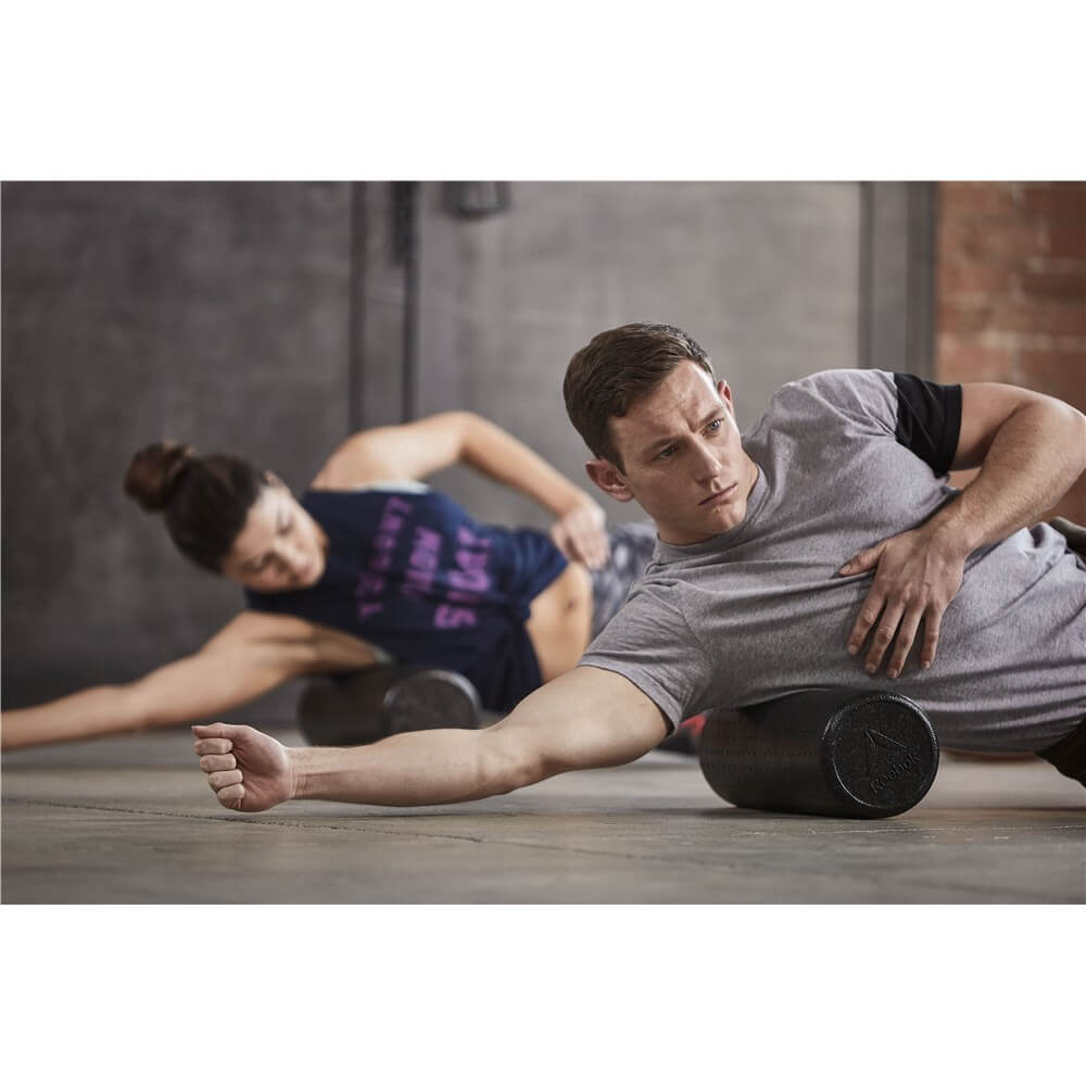 Exercise class foam rolling using Reebok Short Foam Rollers