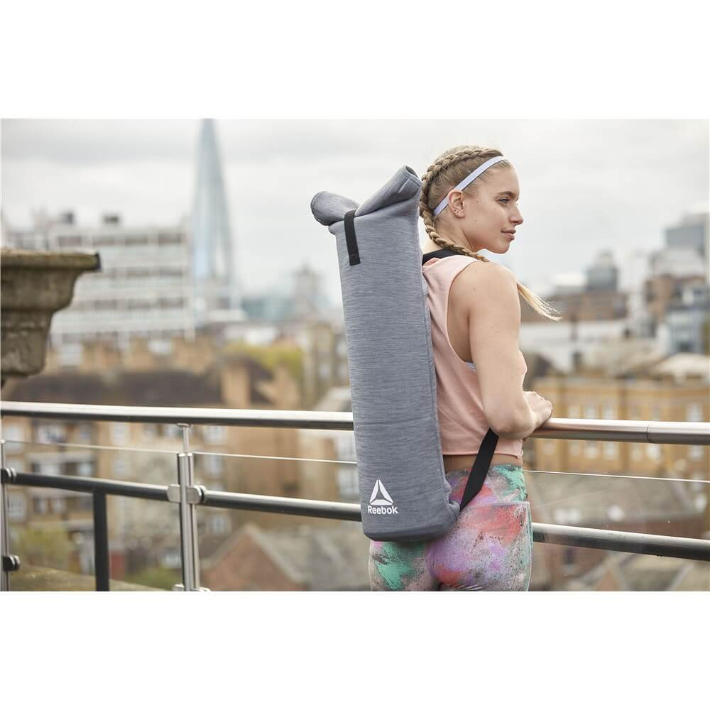 Woman carrying a Reebok Yoga Mat Bag