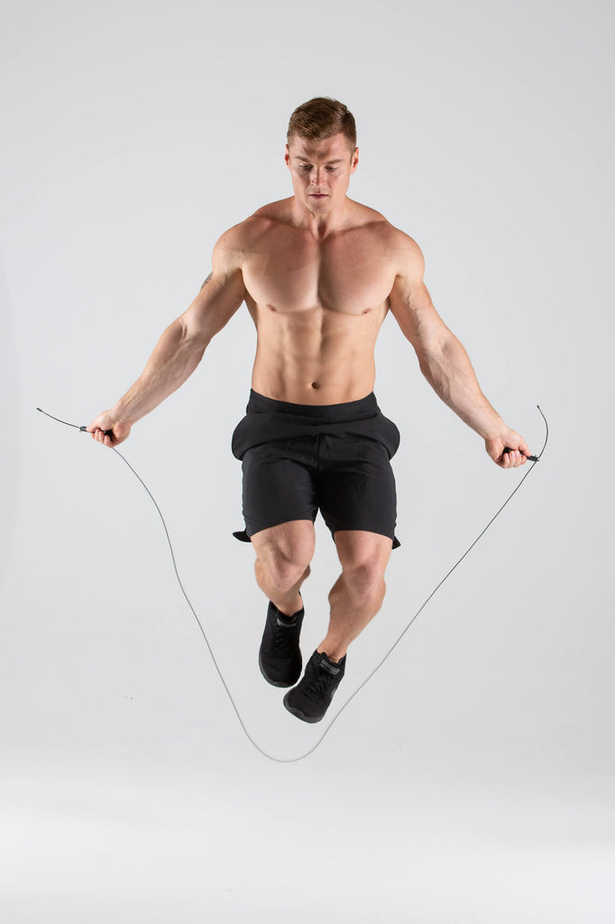 Man skipping using a UXT Adjustable Wire Speed Rope