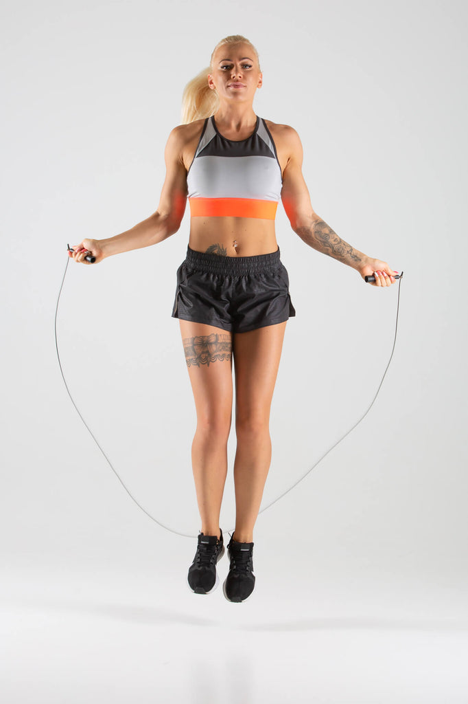 Woman skipping with a UXT Adjustable Wire Speed Rope