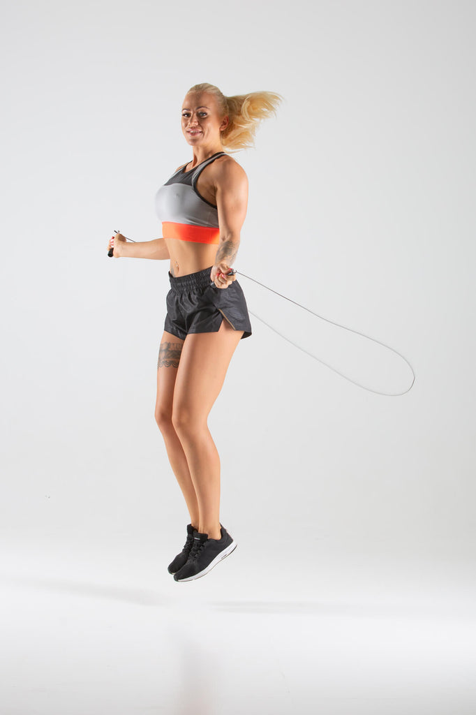 Woman skipping with a UXT Adjustable Wire Speed Rope