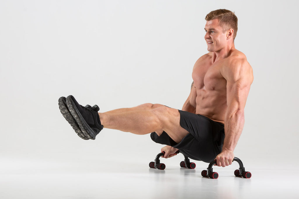 Man exercising using UXT Angled Parallels - Push Up Bars