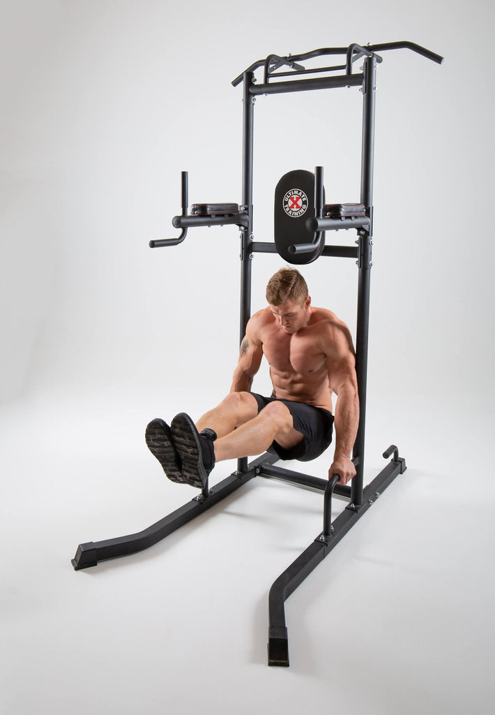 Man exercising on a UXT Ultimate Power Tower