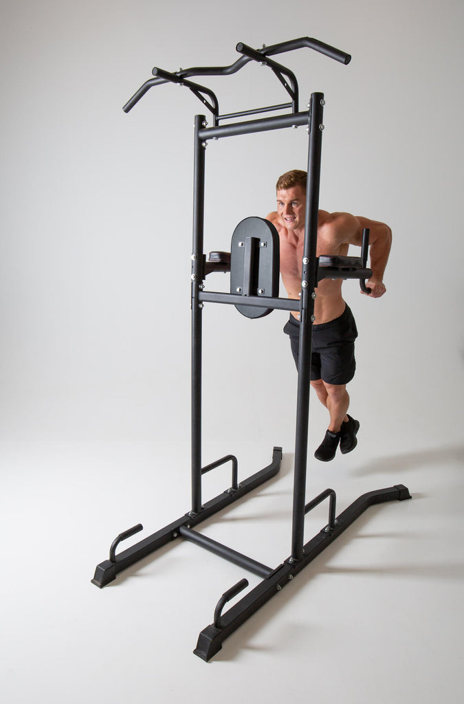 Man performing dips on a UXT Ultimate Power Tower