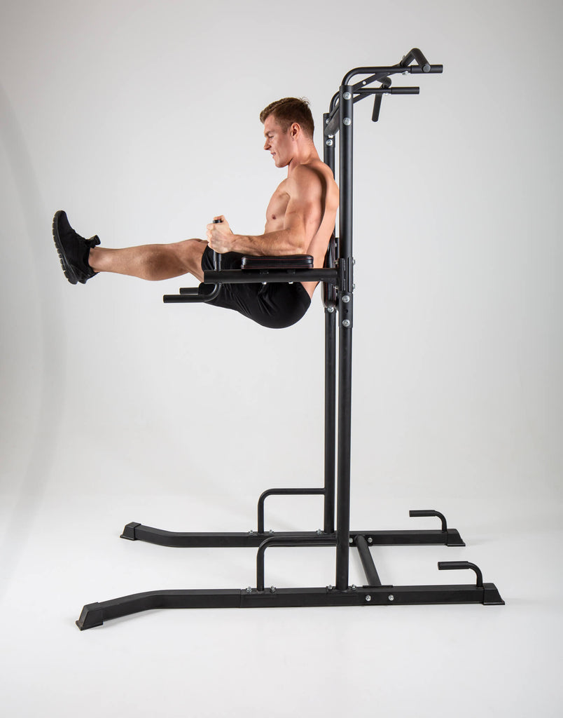 Man exercising on a UXT Ultimate Power Tower