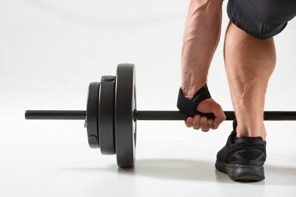 Man deadlifting wearing UXT Weight Lifting Straps with Comfort Pads
