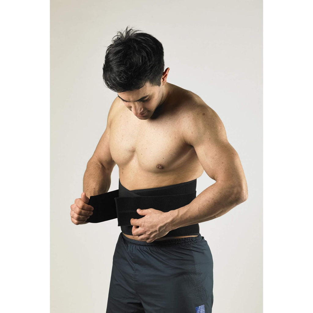 Man adjusting his Vulkan AirXtend Lower Back Support