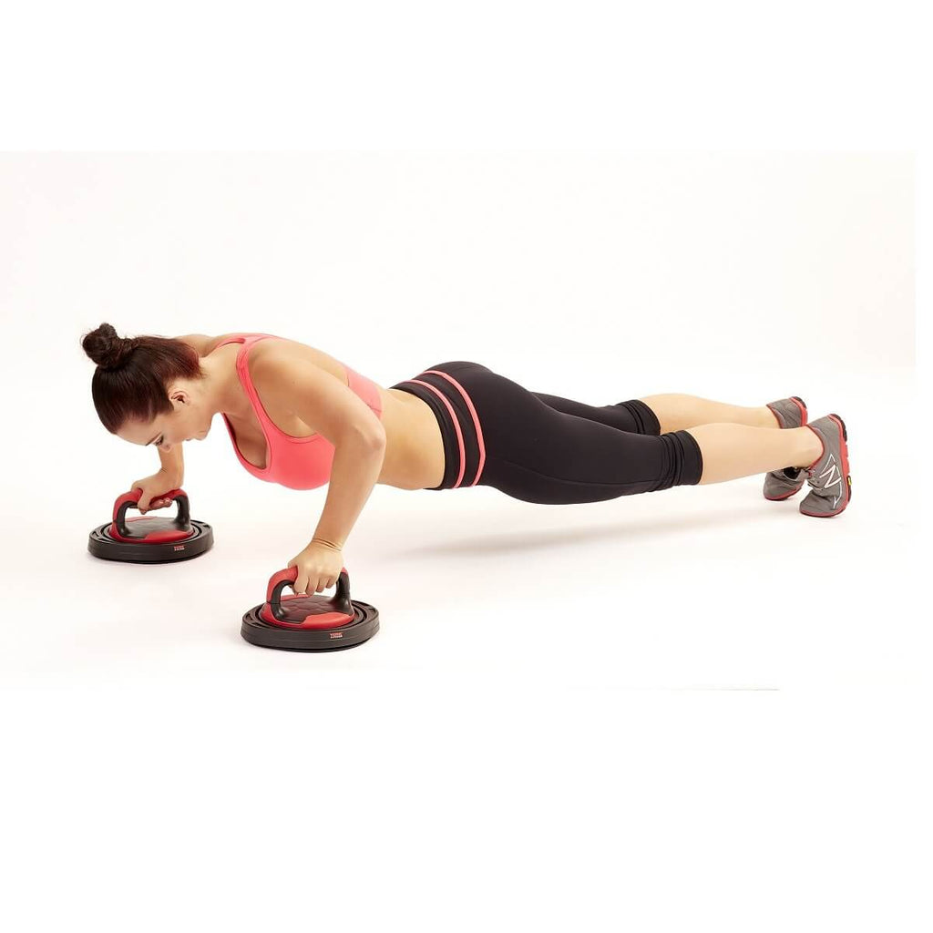 Woman doing push ups with York Fitness Rotating Push Up Bars