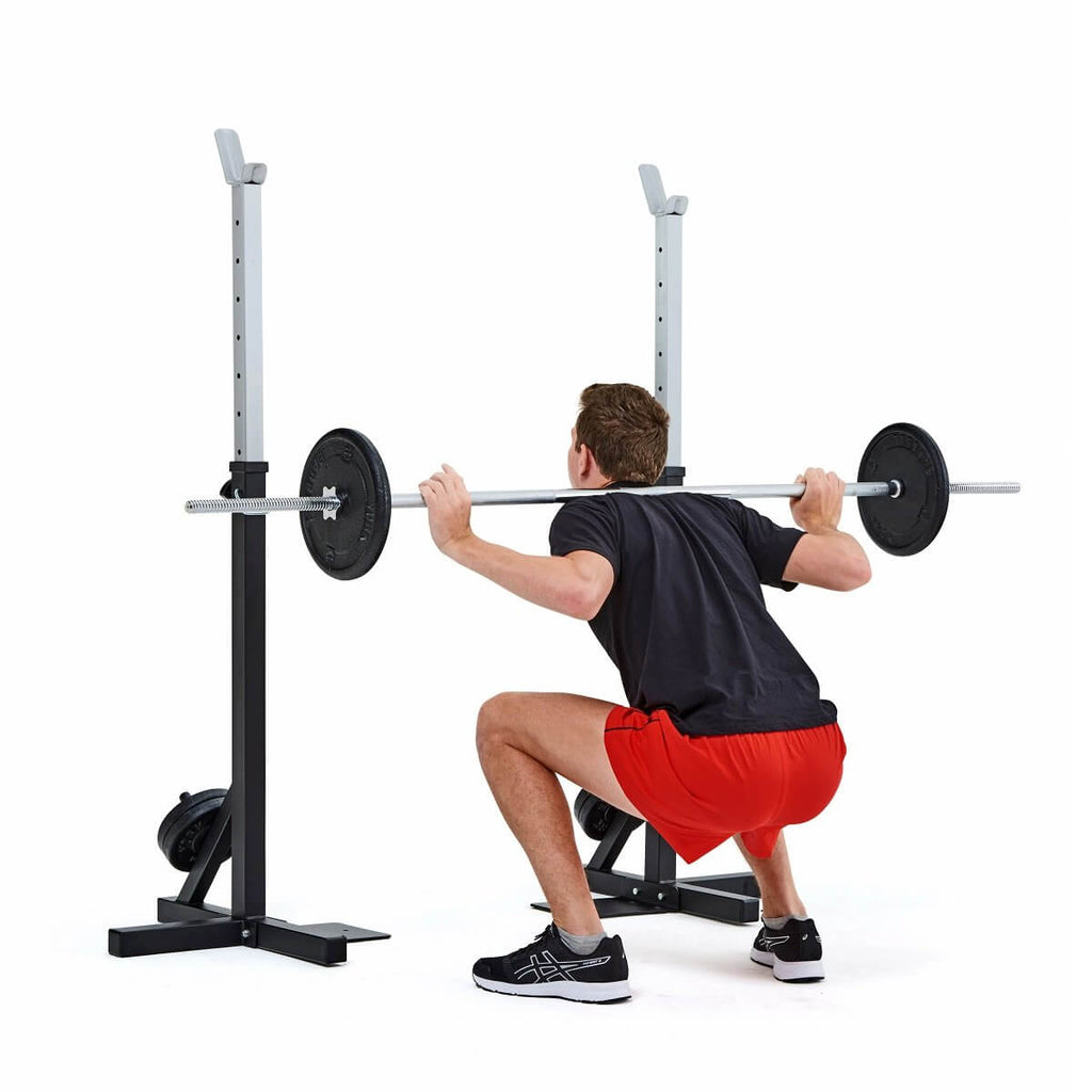 Man performs squats with the York Squat Rack