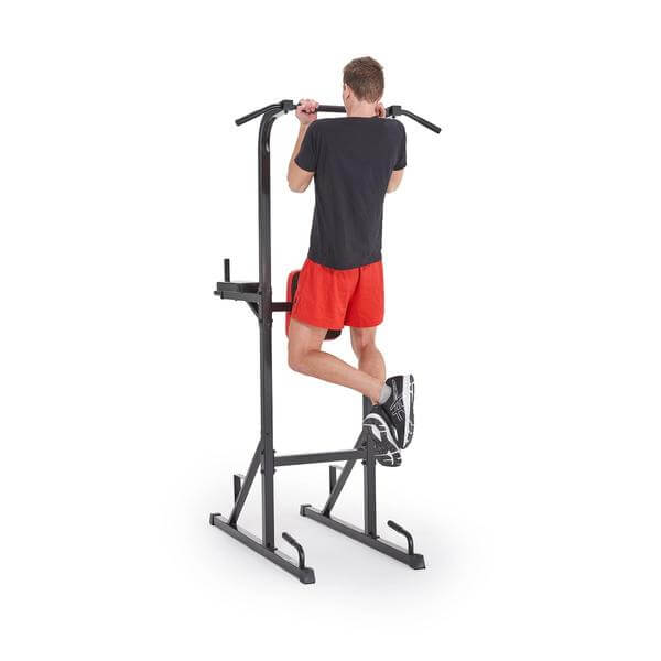 Man performing chin ups on the York workout tower